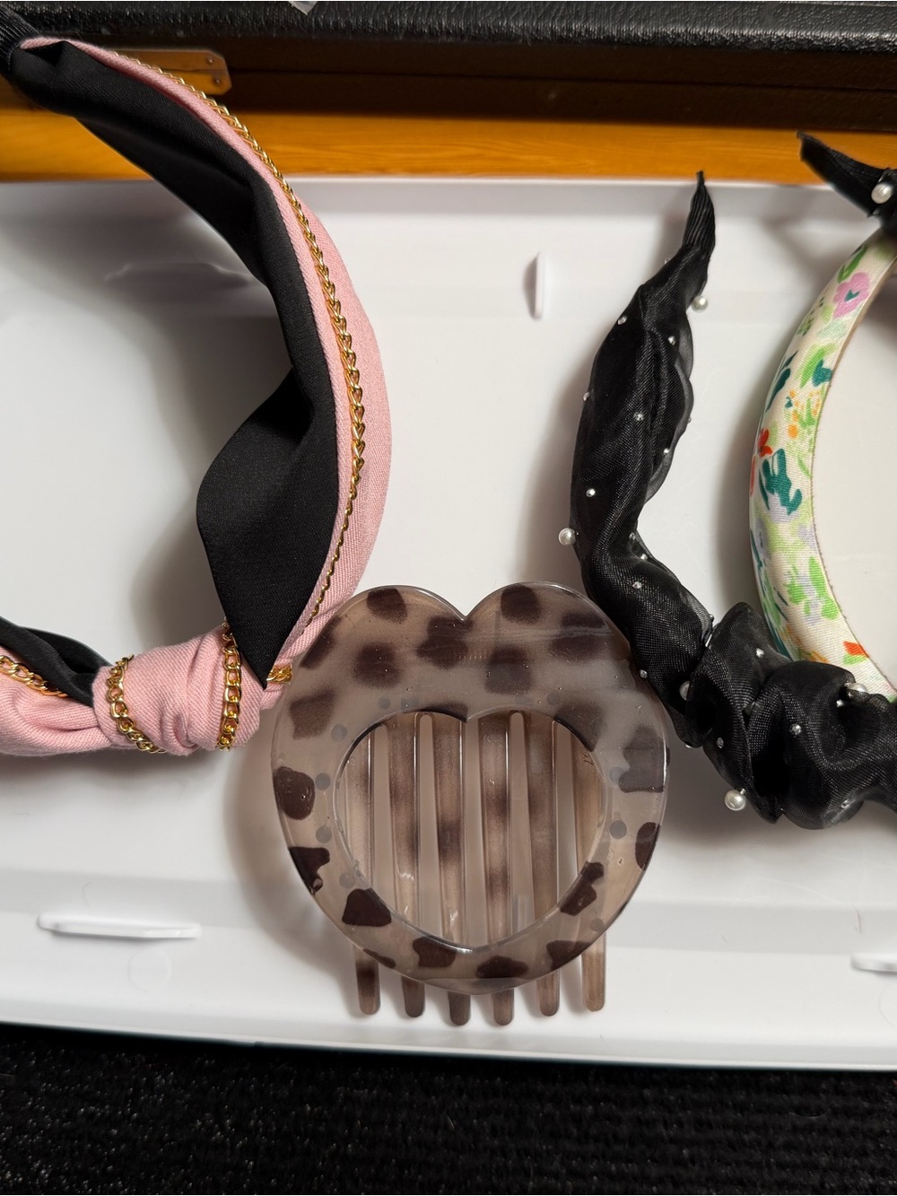 Lot of headbands and one heart clip.